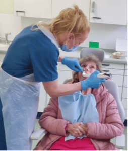 Ann receiving treatment with the new scanner