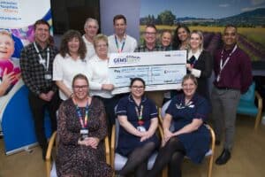 Team from Leicester's Hospitals with the GEMS team during cheque presentation event.